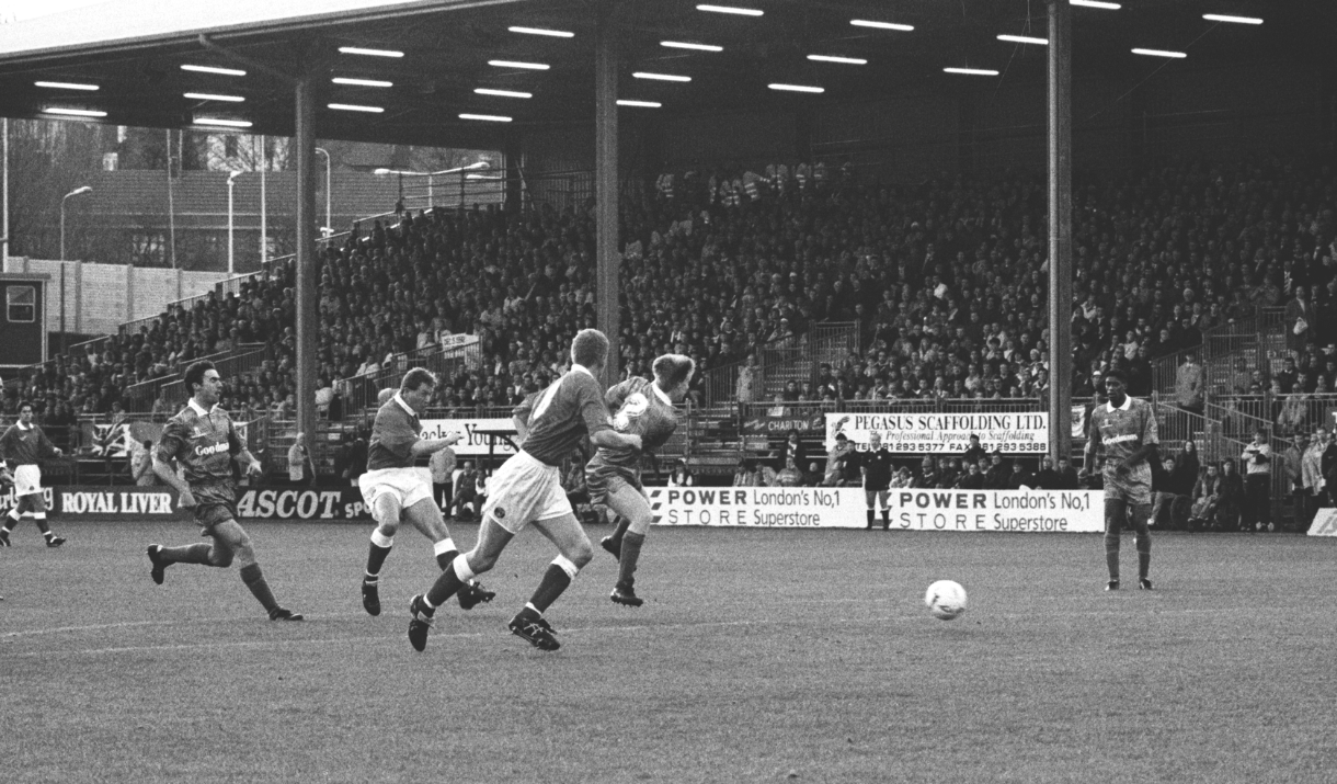 Black and white photo of Walsh scoring a goal for Charlton Athletic Football CLub